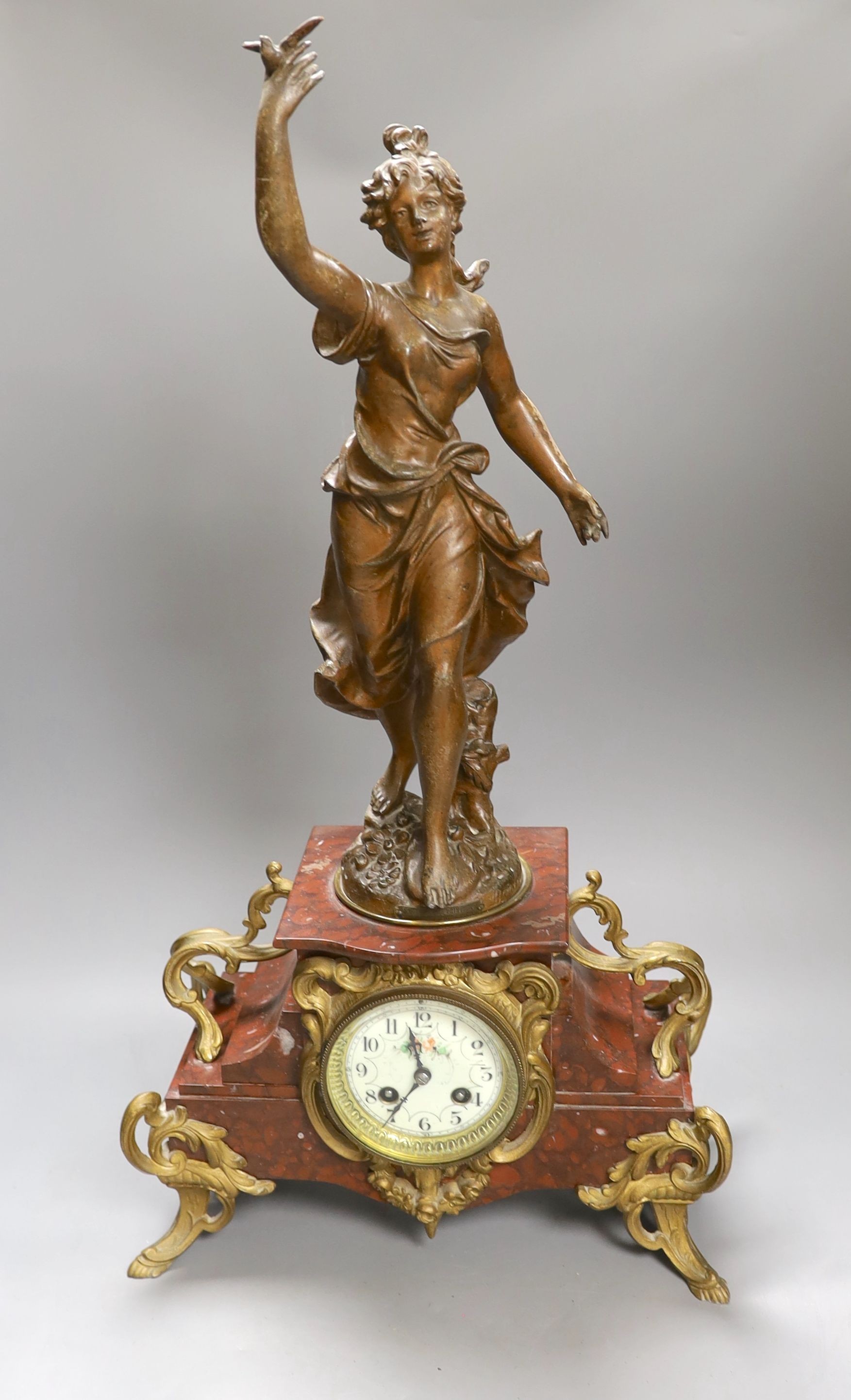 A bronzed spelter and rouge marble figural mantel clock 65cm